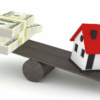 seesaw with money on one end and house on the other